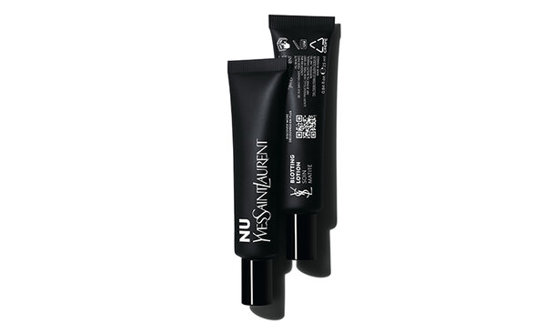 Two sleek black tubes of YSL beauty products, positioned upright with a minimalist white background.