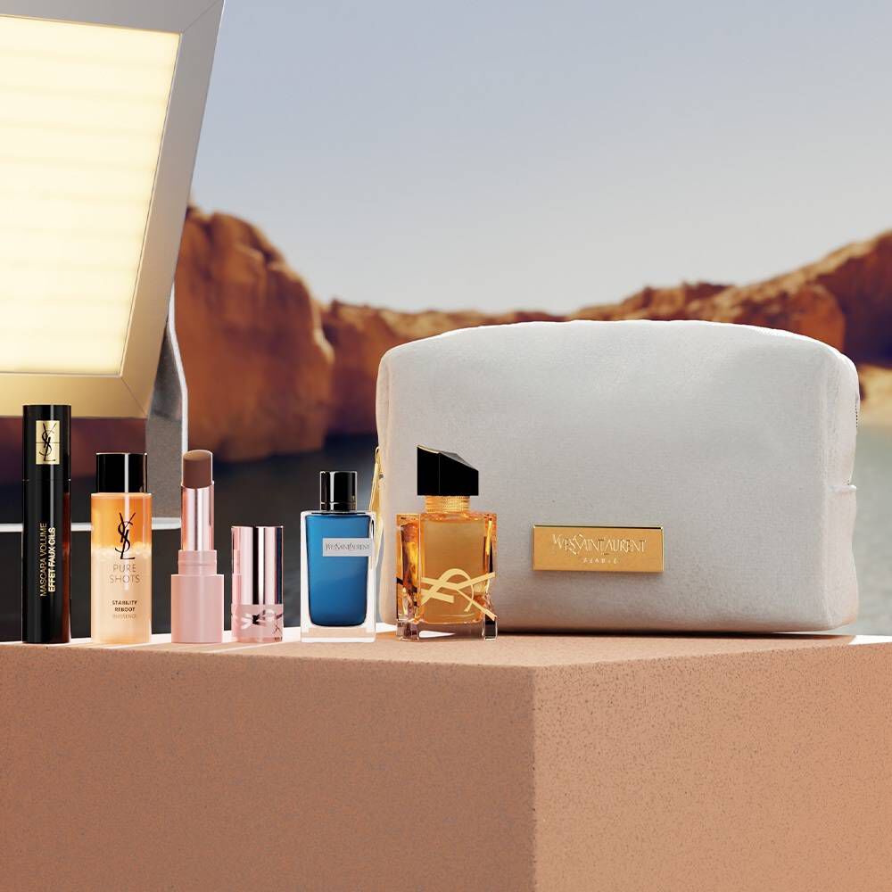 YSL beauty gift set with mini products and white pouch.