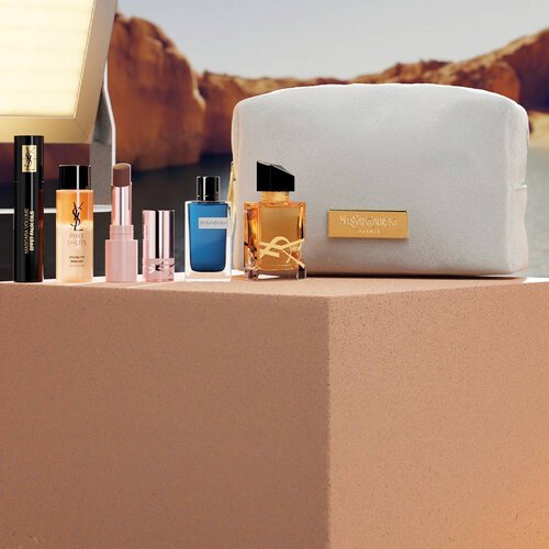 YSL beauty gift set with mini products and white pouch.