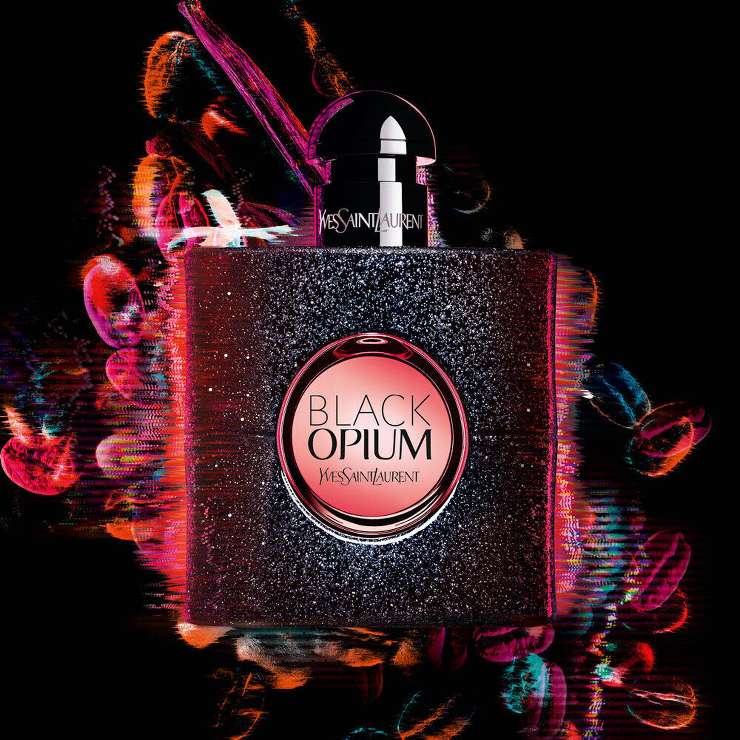 A sleek and stylish bottle of Yves Saint Laurent's Black Opium fragrance, featuring a dark glittery design and a bold pink label, set against a vibrant, abstract background of colorful swirls and lights.