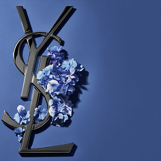 Black YSL logo with blue flowers on blue background