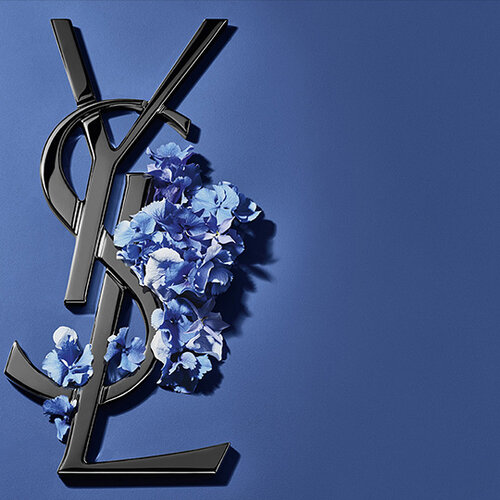 Black YSL logo with blue flowers on blue background