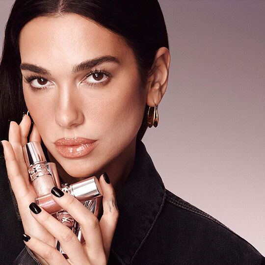 Dua Lipa posing with YSL Loveshine lipsticks.​Dua Lipa posing with YSL Loveshine lipsticks.​