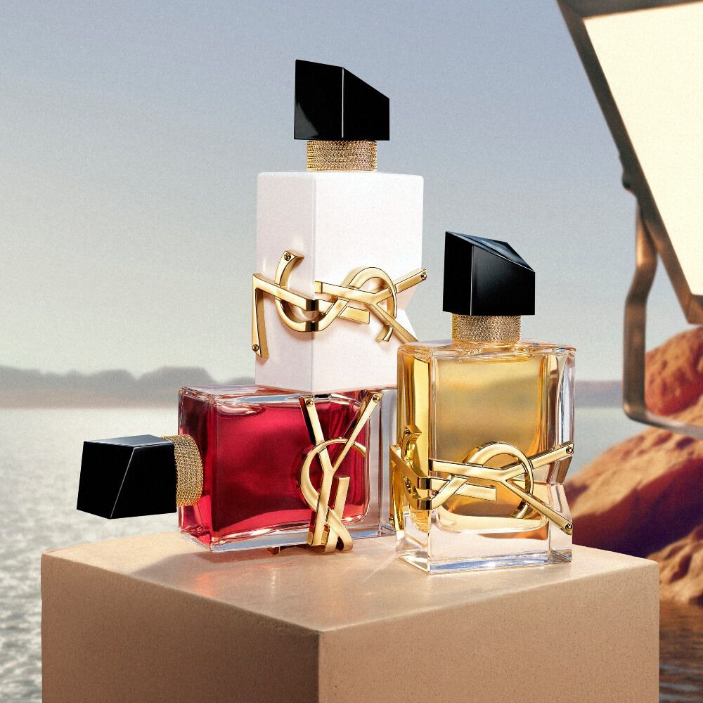 YSL beauty products on a pedestal by the water