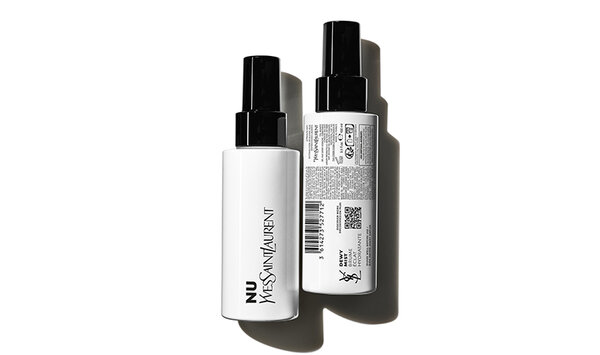 Two sleek spray bottles of NU Yves Saint Laurent product, positioned against a white background, showcasing their elegant design and labels.