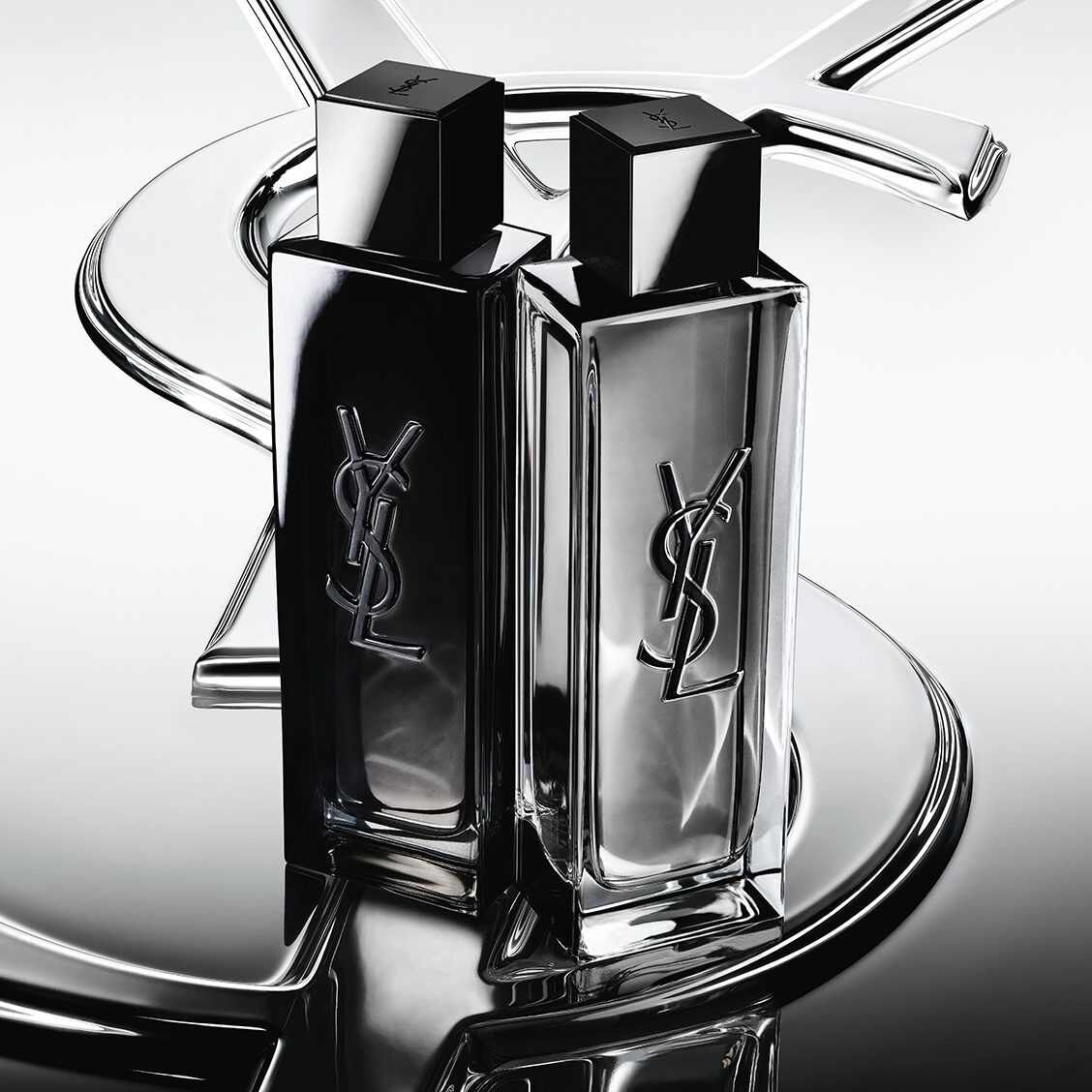 Two YSL fragrance bottles in black and silver