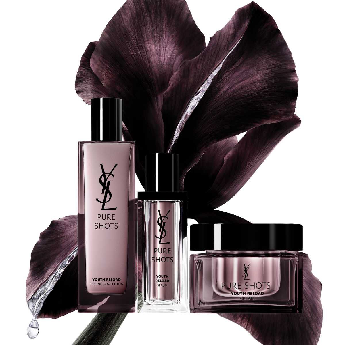 YSL Pure Shots skincare products in front of a dark flower backdrop.