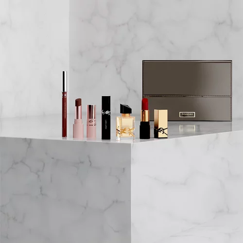 YSL beauty gift set with mini products and a pouch.
