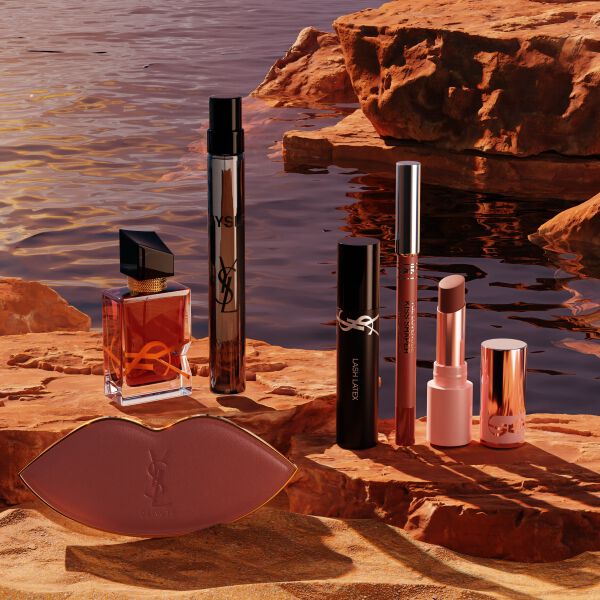 YSL beauty gift set with mini products and white pouch.
