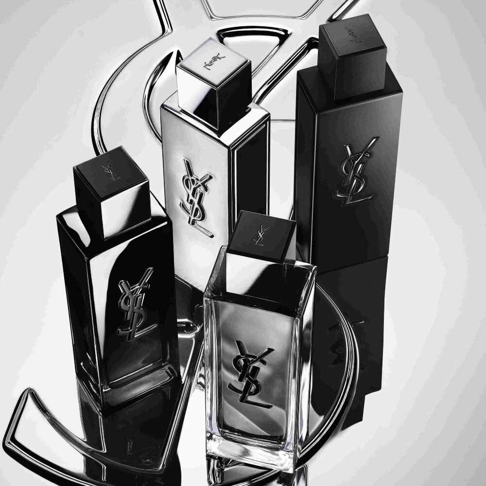 Four YSL fragrance bottles in black and silver