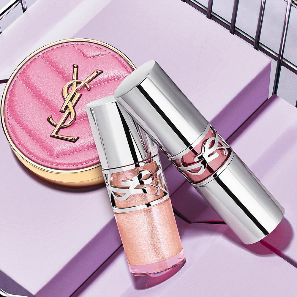 YSL LOVESHINE lip oils and Make Me Blush compact on a lavender background.
