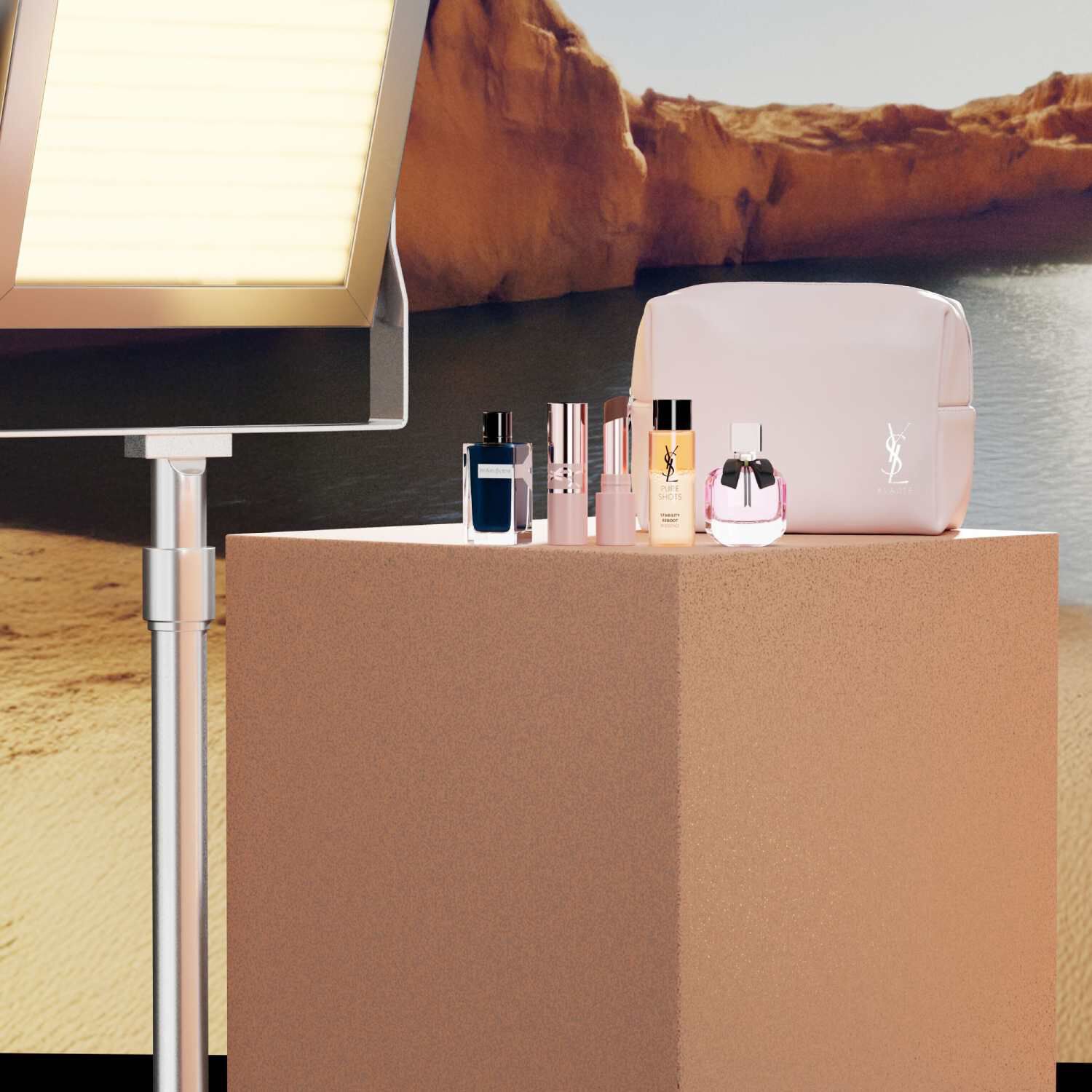 YSL beauty gift set with mini products and pink pouch.