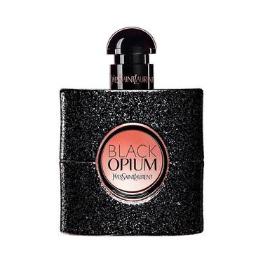 A bottle of Yves Saint Laurent Black Opium perfume, featuring a glittery black exterior and a round label with the product name in bold.