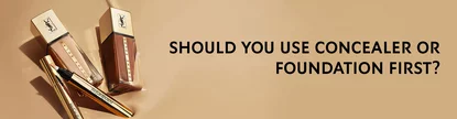 Image of two bottles of foundation and a concealer pencil against a beige background, accompanied by the question, "Should you use concealer or foundation first?" in bold black text.