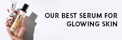 A hand holding two YSL skincare products, with a text overlay that reads "OUR BEST SERUM FOR GLOWING SKIN."