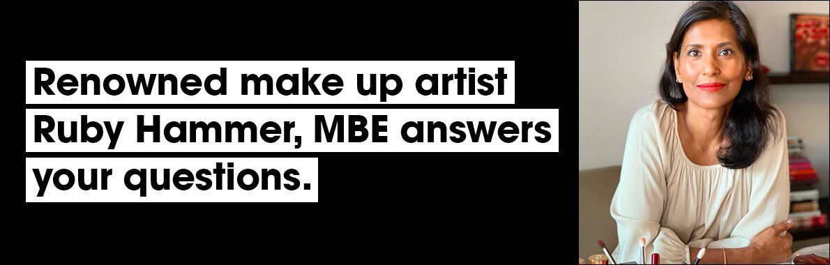 A portrait of a woman with long, dark hair, sitting at a table with makeup products, accompanied by text announcing that renowned makeup artist Ruby Hammer, MBE, is available to answer questions.