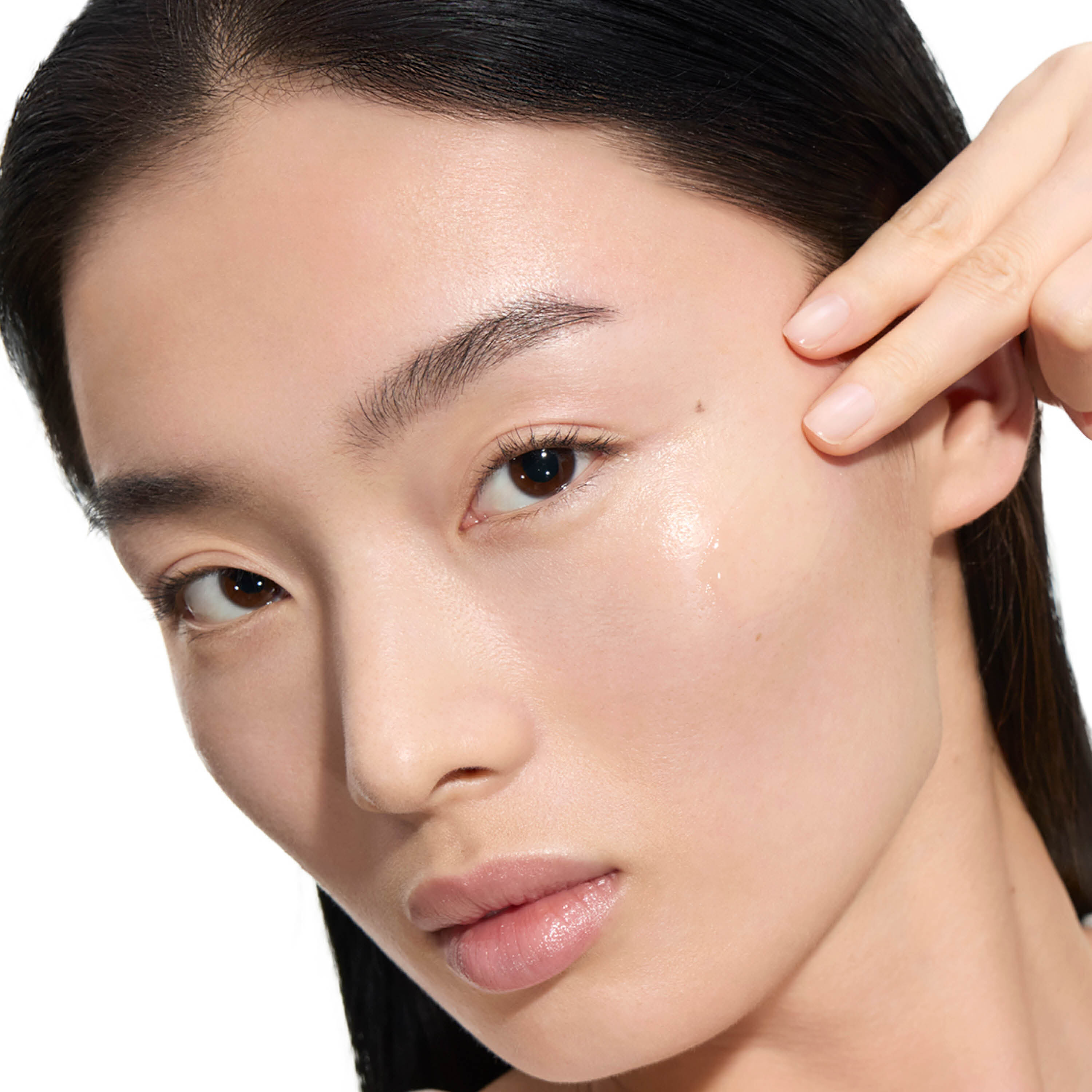 Close-up of a person’s ear, hairline, and neck with face blurred