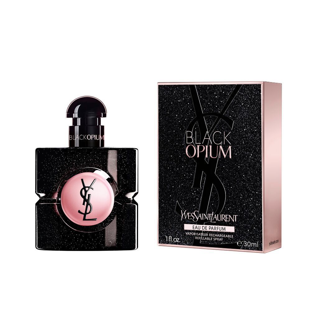 Black Opium Eau de Parfum bottle next to its matching black glittery box featuring the YSL Cassandre.