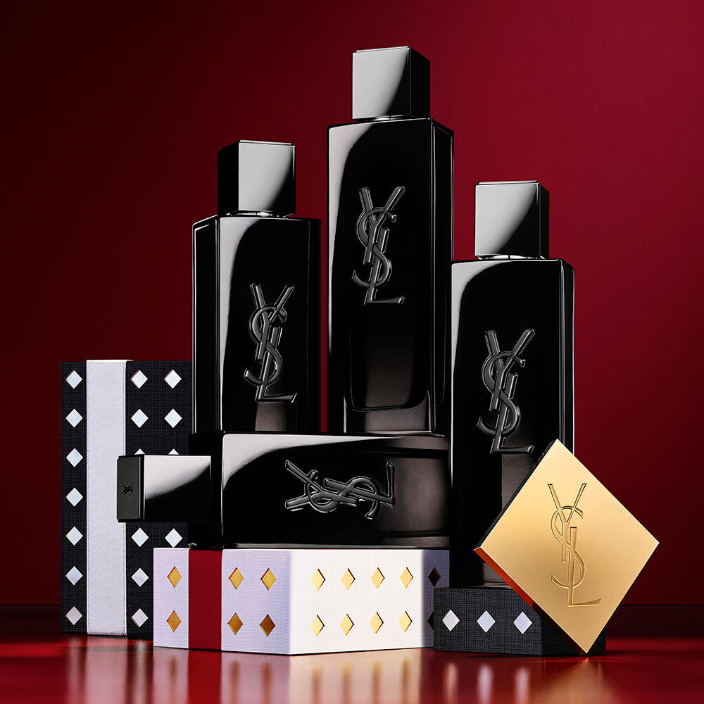 YSL MYSLF Eau de Parfum bottles stacked on black and silver patterned Holiday gift boxes.