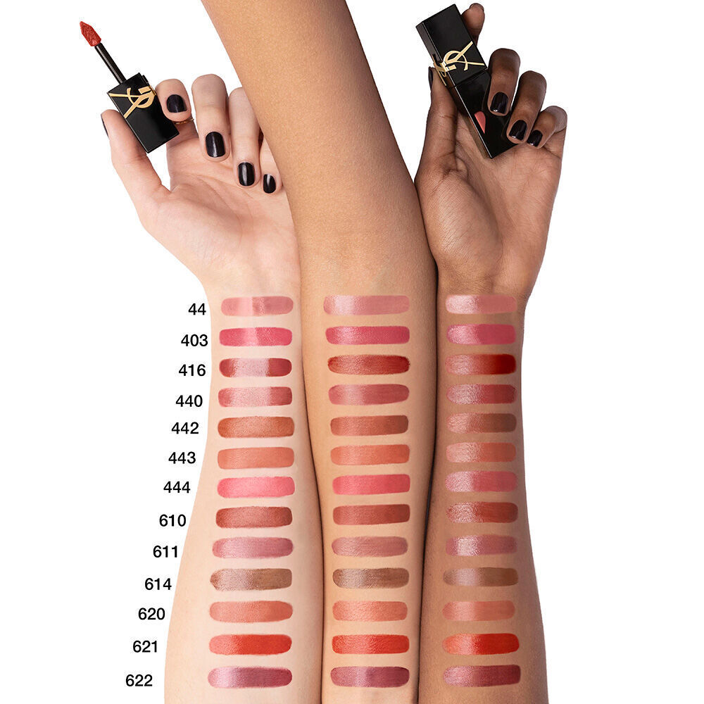 Heart-shaped lip stain swatches displayed on light, medium, and deep skin tone arms, with each hand holding a black YSL lip stain bottle with black manicured nails.