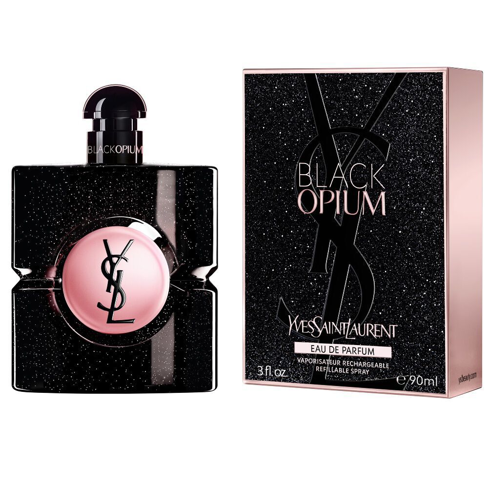 Black Opium Eau de Parfum bottle next to its matching black glittery box featuring the YSL Cassandre.
