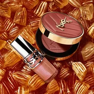 YSL LOVESHINE Plumping Lip Oil Gloss shade 10 and Make Me Blush shade 66, amidst vibrant pink heart-shaped sweets.