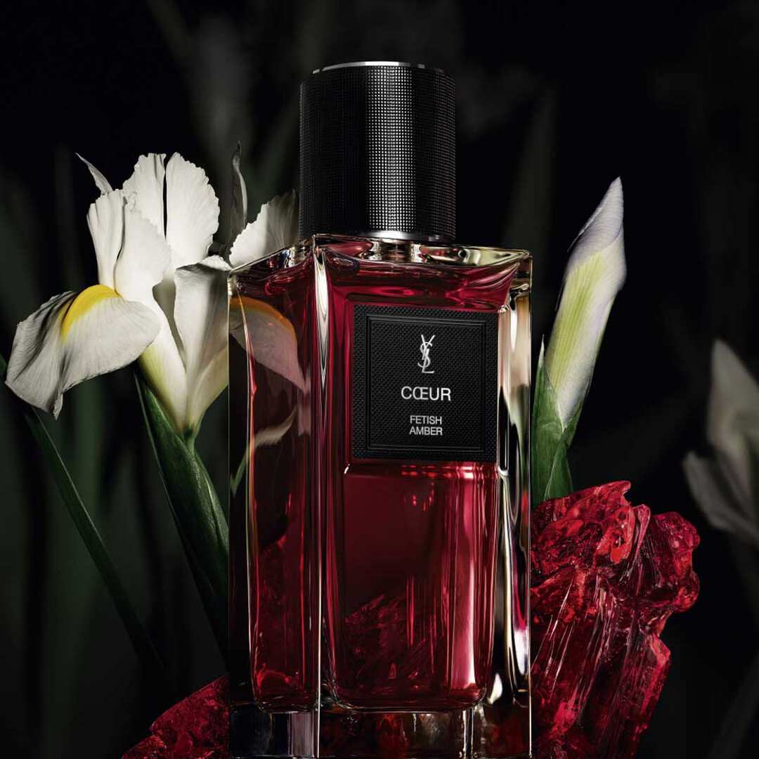 YSL perfumered  bottle with white flowers.