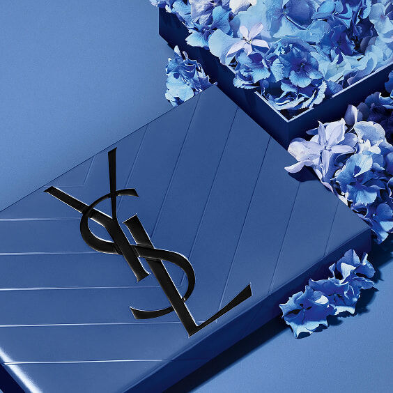 YSL Father's Day blue gift set, featuring the iconic Cassandre logo, overflowing with delicate blue floral accents.
