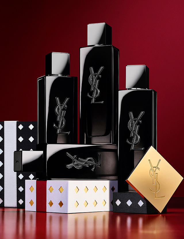YSL MYSLF Eau de Parfum bottles stacked on black and silver patterned Holiday gift boxes.