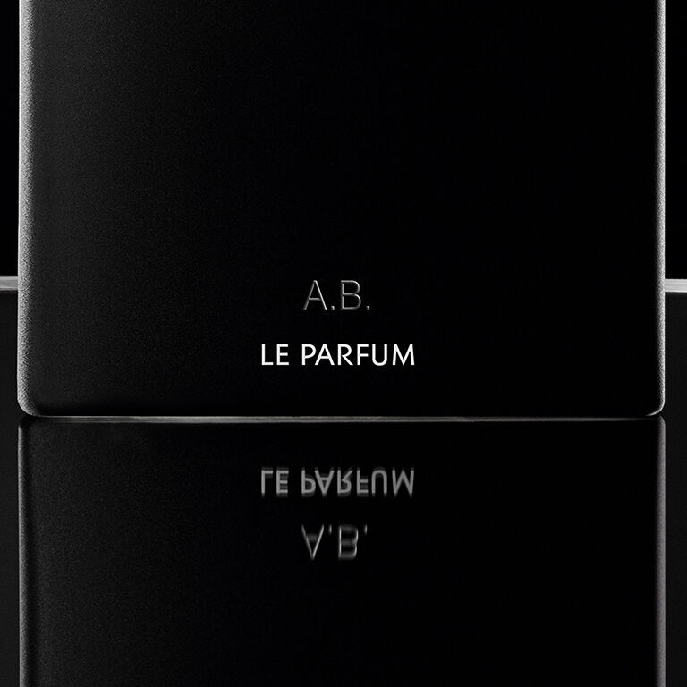 Close-up of a personalized YSL MYSLF Le Parfum bottle, engraved with 'A.B.', showcasing the art of luxury gifting.