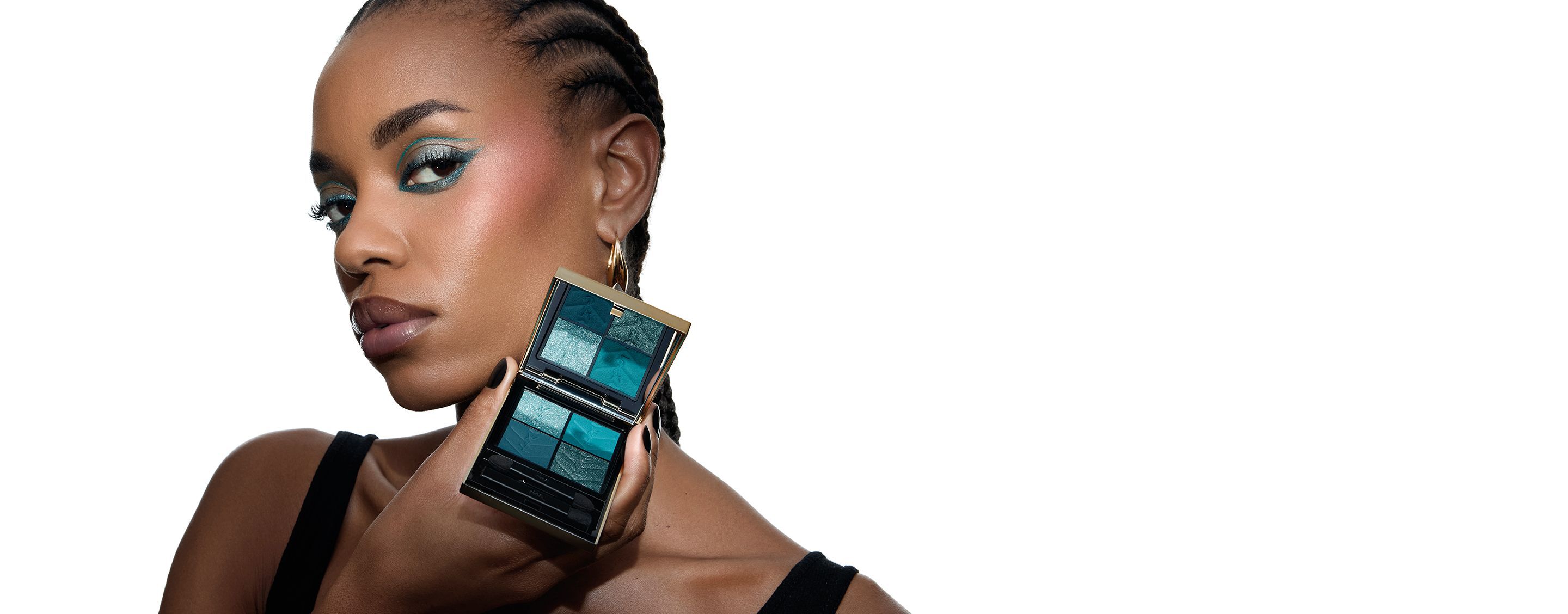Lizette, YSL Beauty model, holding a YSL Couture Mini Clutch eyeshadow palette, with matching turquoise eye makeup.
