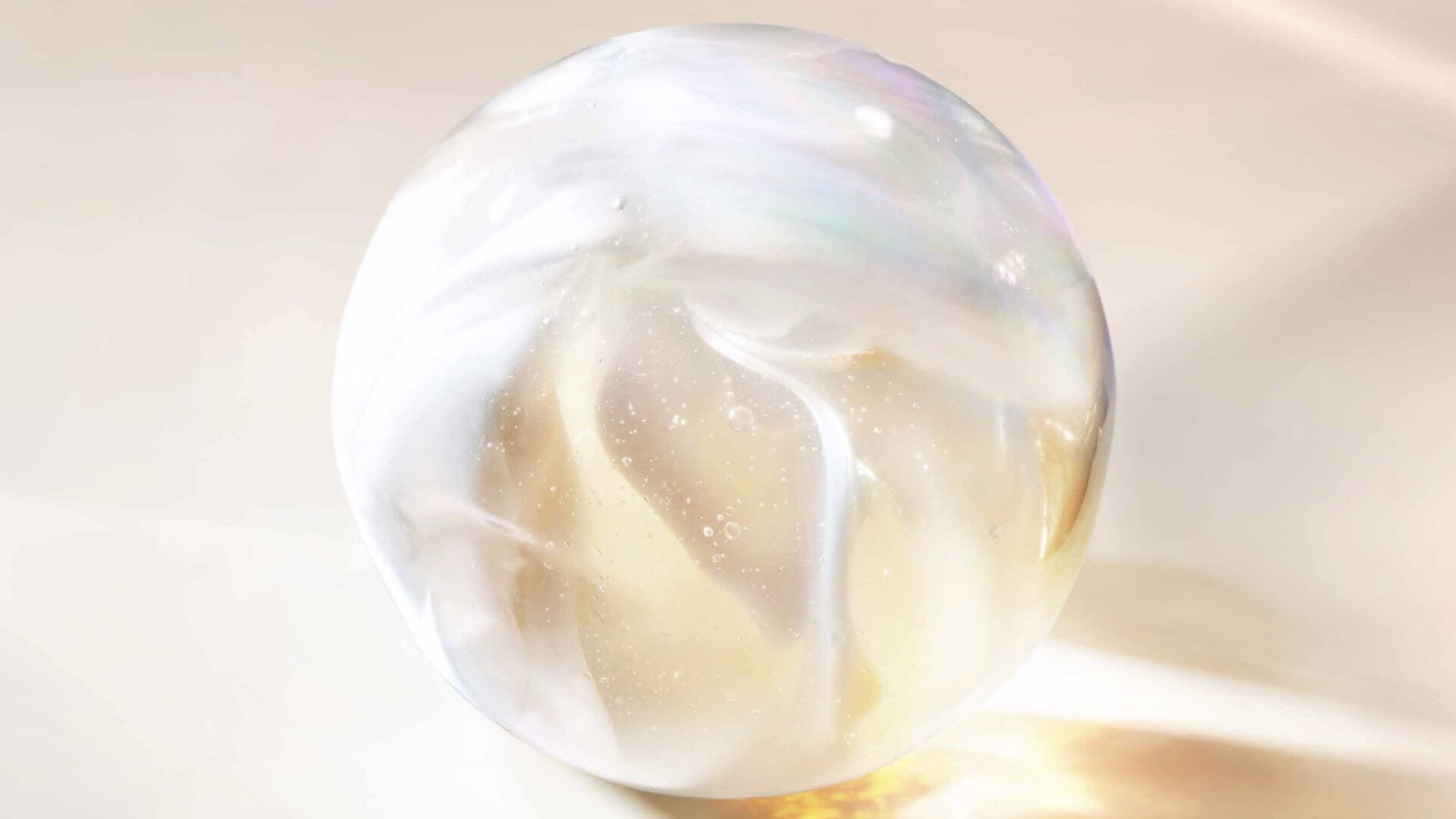Iridescent skincare sphere texture