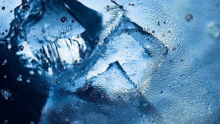 Close-up of ice and water droplets, evoking the intense, icy freshness 
of YSL Y Eau de Toilette Intense Iced Cologne.